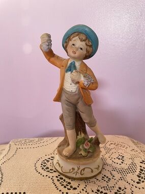 Blue-Hat Boy Figurine Porcelain Home Accent holding grapes